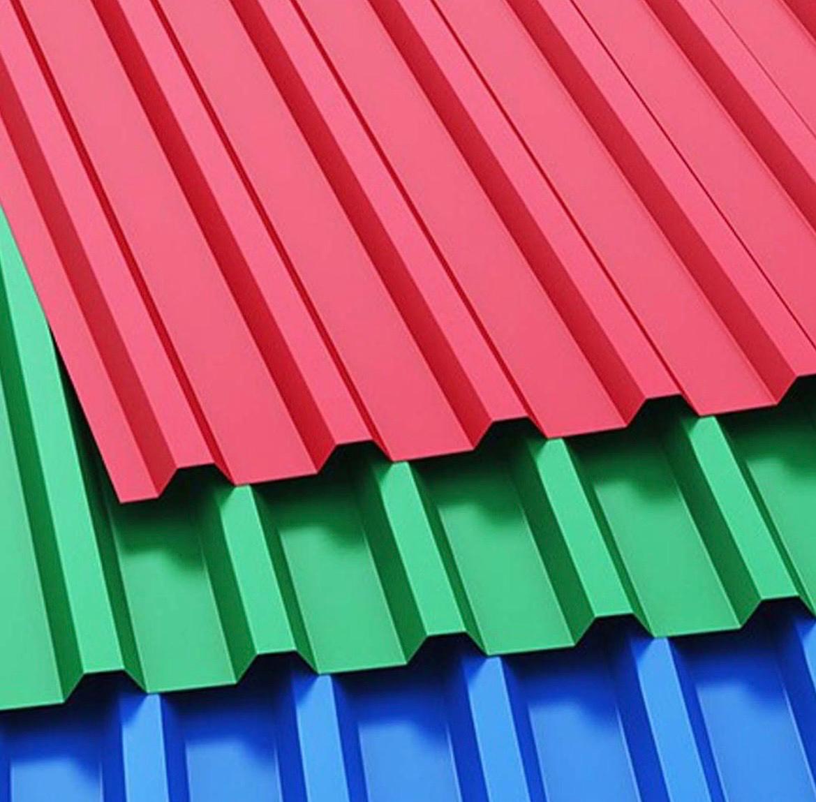 Red, green and blue IBR roof sheets stacked
